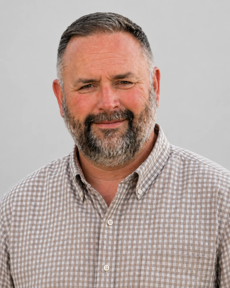 Color portrait of Bennie Atkinson on a light gray background.