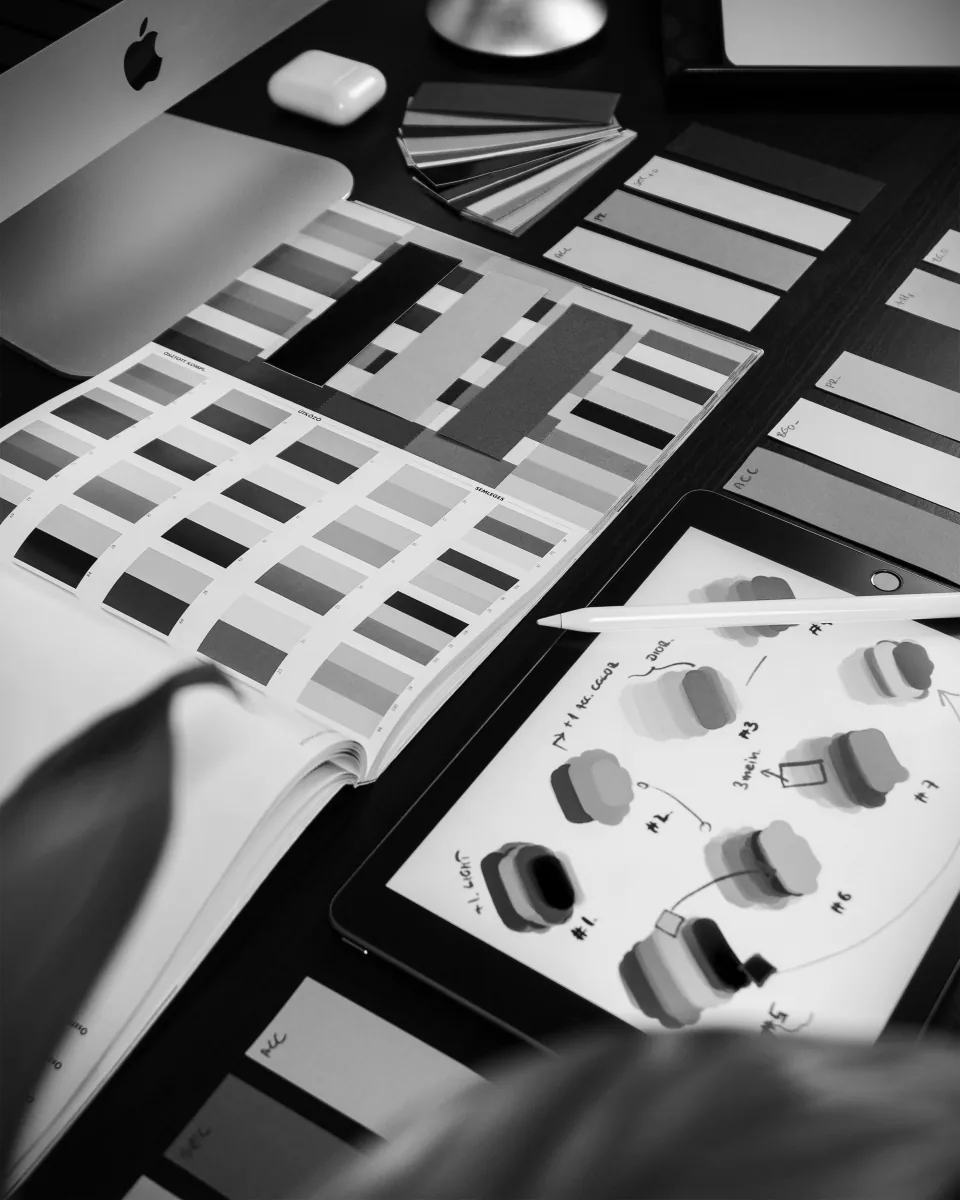Design tools and a tablet used to explore a visual identity