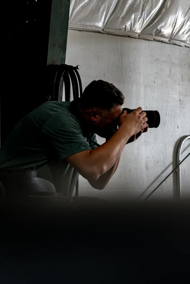 Photographer using a camera during an indoor shoot