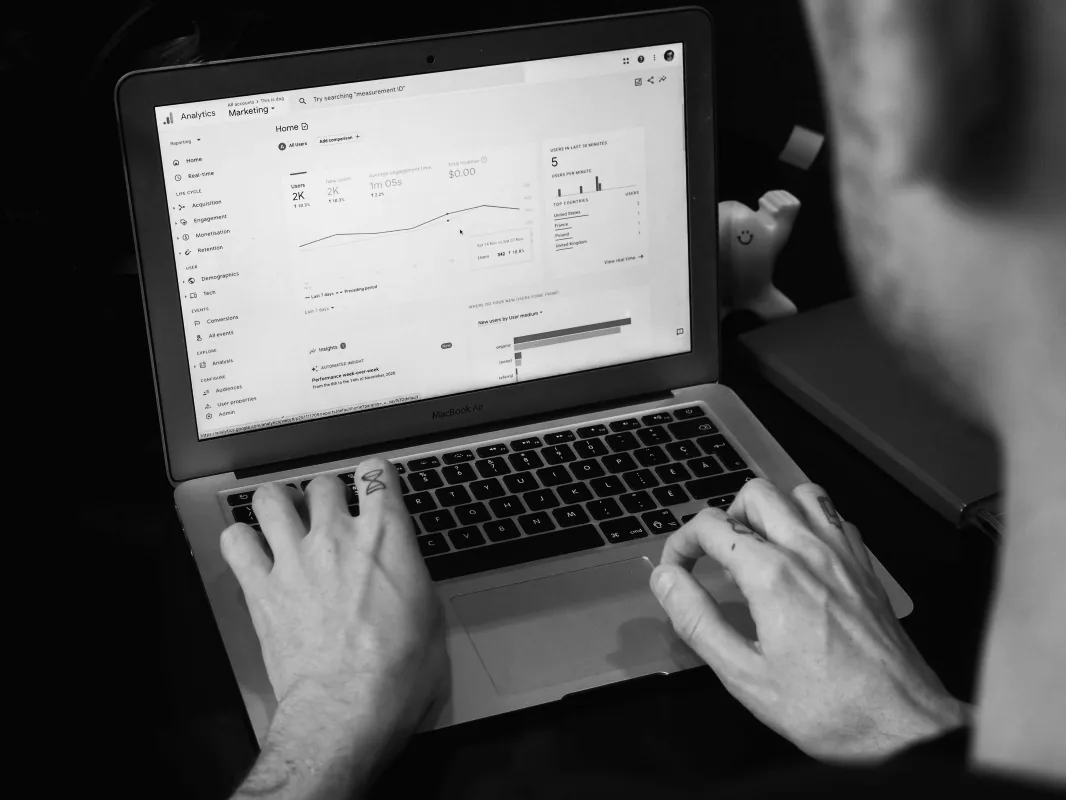 Reviewing website analytics on a laptop